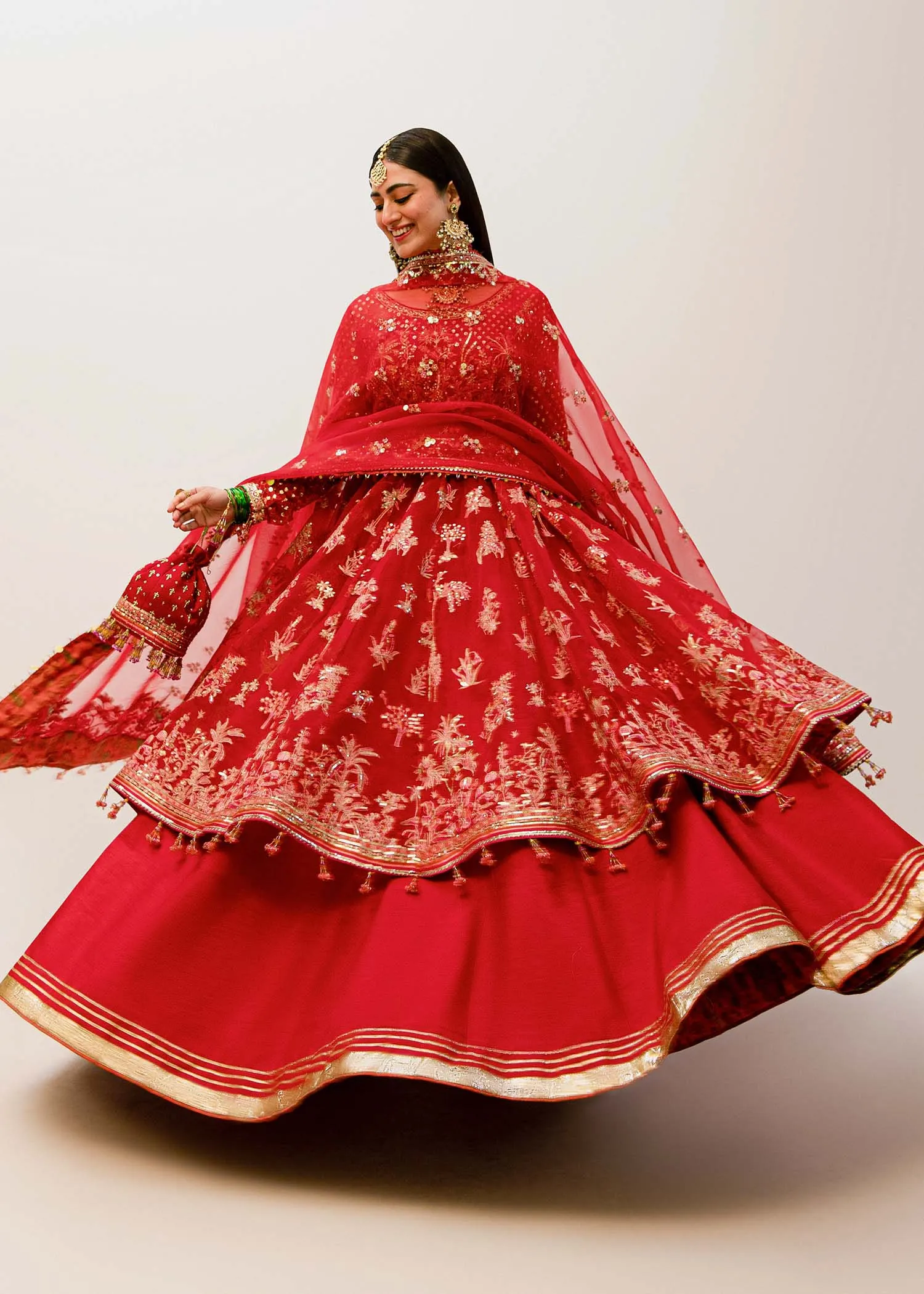 Red Pakistani Bridal Dress in Pishwas and Sharara Style